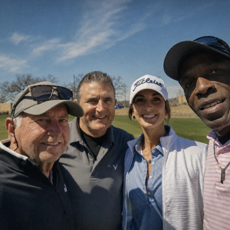 Four friends close together on the course